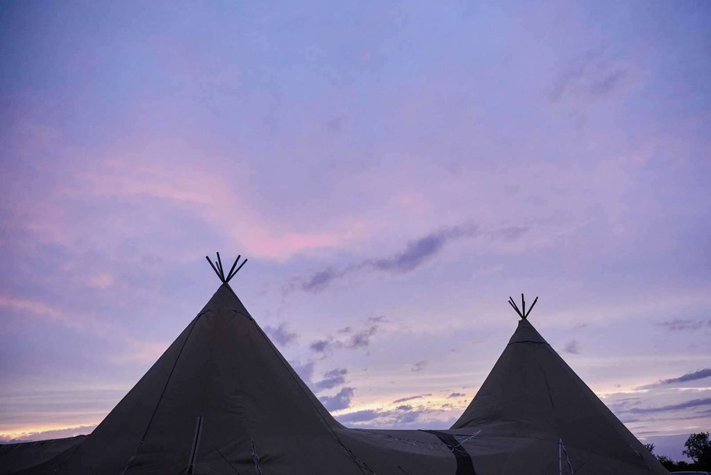 sunset over tipi tents