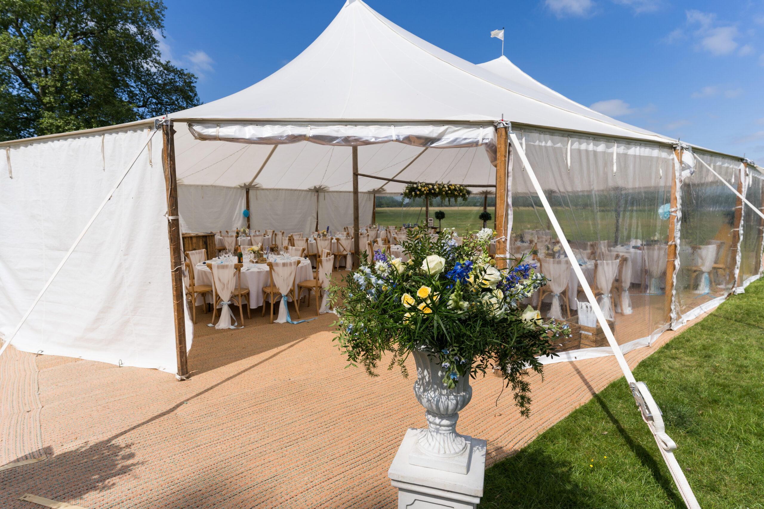 Sailcloth tent showing clear and solid sides