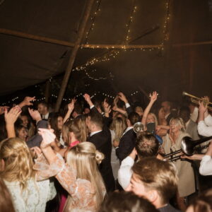 Guests enjoying a winter tipi party at night